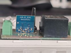ESP8285 smart switch module on a PCB with the label AJW-02_8285.