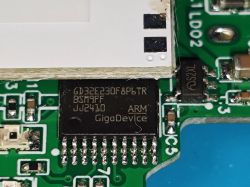 GigaDevice microchip on a green circuit board with markings GD32E230F8P6TR ARM.