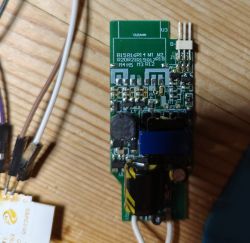 Close-up of a circuit board with various electronic components and several connected wires.
