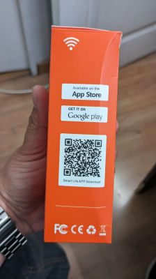 Side of Wall Switch Box Orange box with a QR code and information about app availability on the App Store and Google Play.