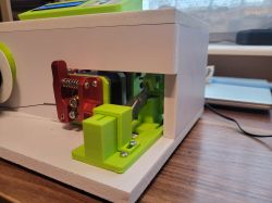 Cutting Mechanism of the Wire Cutting Machine View of the mechanical construction of a wire cutting machine with green and red components.