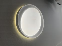 LEDVANCE Orbis Eye Ceiling Light Round LED ceiling light with soft edge lighting on a white wall.