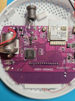 Close-up of a circuit board with a Holtek BA45F6746 chip and other electronic components.