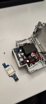 Disassembled Relay with Visible Electronic Components Open relay with visible electronics inside the housing.