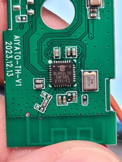 Close-up of a circuit board with a BL602L10 S9FSR5 chip marked AIYATO_TH_V1 2023.12.13.