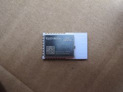 E103-W08A module by EBYTE on cardboard background.
