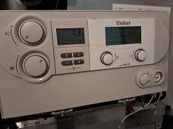 Vaillant ecoCOMPACT Boiler Control Panel Control panel of Vaillant ecoCOMPACT boiler with display and knobs.