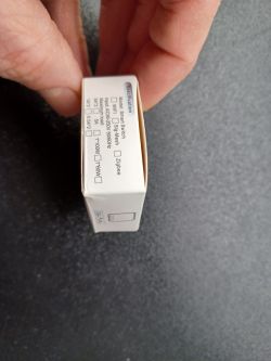 Smart Switch Box A smart switch box held in a hand, showing technical specifications.
