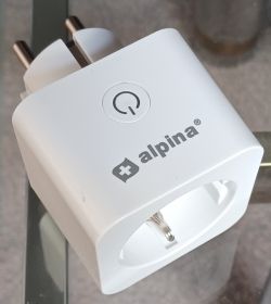 Alpina Smart Plug White Alpina smart plug with a button on top.