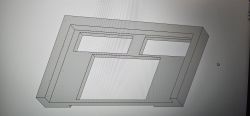 Screenshot of a 3D model of a rectangular panel with several rectangular cutouts