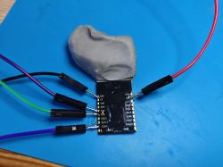 M0L200PX wifi module on a blue mat with several connected wires.