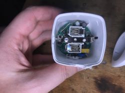 Disassembled electrical plug with visible interior and circuit board.