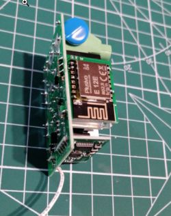 Relay with Replaced ESP12F Module Relay with ESP12F module mounted on a desk.