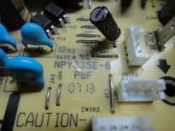 Close-up of a printed circuit board marked NPY335E-8 with various electronic components.