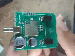 PCB with electronic components, including capacitors and an RF connector