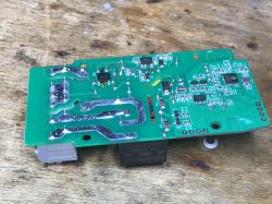 PCB of the WS-05H1 Device PCB with electronic components of the WS-05H1 device on a wooden background.