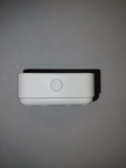 Side view of a white temperature and humidity sensor.