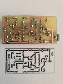 Printed Circuit Board with Etched PCB Pattern Printed circuit board with soldered components, next to an etched PCB pattern.
