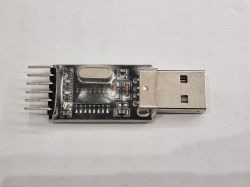 USB-TTL Adapter with Pins USB-TTL adapter with pins and casing.