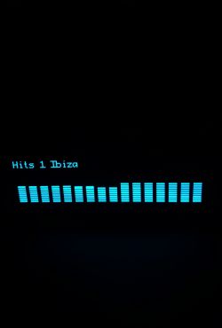 Screen with “Hits 1 Ibiza” text and blue sound equalizer bars