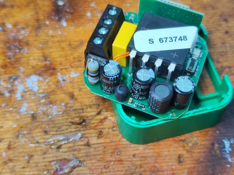 Interior of DIW-01 Dimmer Module DIW-01 dimmer module with visible electronic components on a green circuit board.