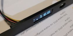 Digital display embedded in black PLA case with multicolor wires on the left