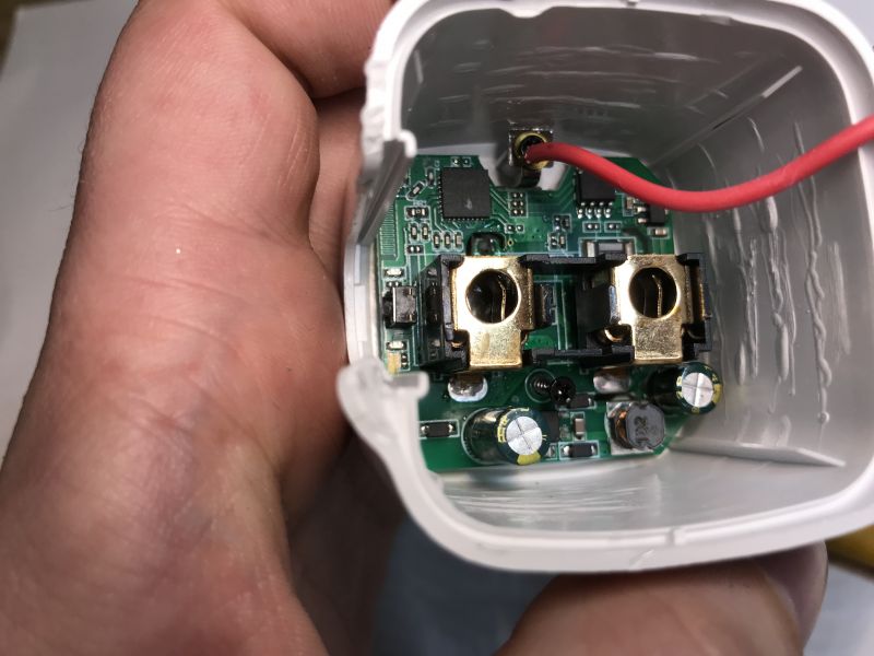 Interior of an Electronic Device View of the interior of an electronic device with visible circuit board and components.