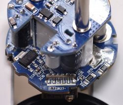 Close-up of the internal components of a disassembled Smart Plug with visible electronic elements.