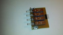 Printed Circuit Board with Switches Printed circuit board with three switches and electronic components.