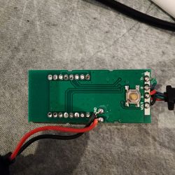 Back of a circuit board with wires soldered to labeled pins.
