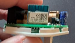 Close-up of an electronic module with CE marking mounted on a circuit board