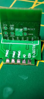 Image of a green printed circuit board with various connectors and labels.