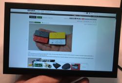 EM713 monitor displays elektroda.pl webpage with image of 3 small electronic devices