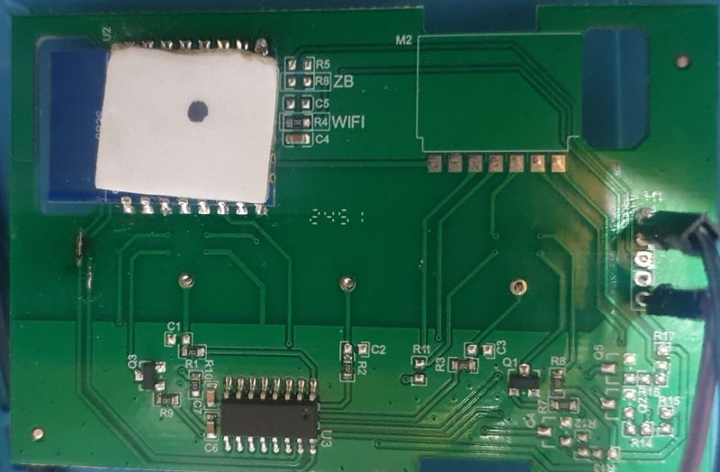 Green PCB with a labeled “WIFI” module and an IC, showing traces and SMD components