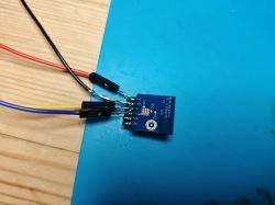 Electronic Module with Connected Wires Electronic module with several connected wires on a blue mat.