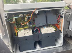 Inside the Solar Tracker Controller Solar tracker controller inside a housing with visible wires and components.