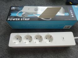 LSC Smart Connect Power Strip with Packaging LSC Smart Connect power strip with packaging on a carpet background.