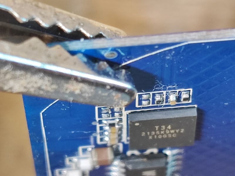 Close-up of T34 Chip on PCB Close-up of a PCB with a T34 chip.