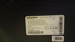 Label of Grundig TV with model information and warnings.