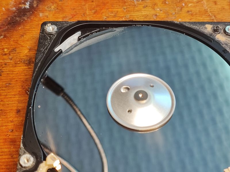 Flooded Hard Drive with Visible Moisture Interior of a flooded hard drive with visible moisture traces