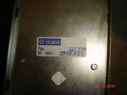 Metalowa obudowa z etykietą „TELKOM TELMOR” oraz polami „Typ” i „Nr fabr.”