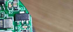 Circuit Board with AMS1117 3.3 DX2W Component Close-up of a circuit board with an AMS1117 component labeled 3.3 DX2W.