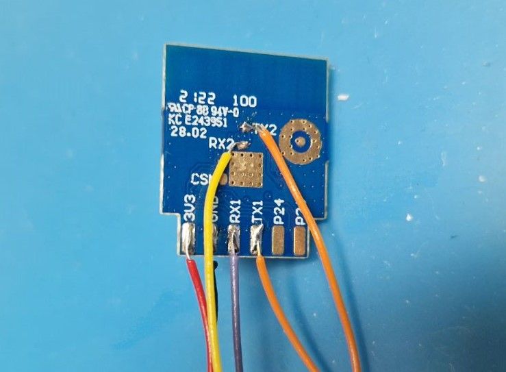 Electronic module with 3V3, RX1, TX1, RX2 pins and soldered colored wires