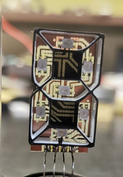 Close-up of custom LED display using WS2812 SMD 5050 modules in segmented pattern
