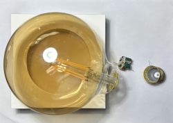 Top view of a disassembled LED bulb showing its interior and electrical components.