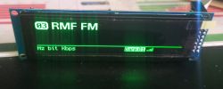 LCD display showing RMF FM on channel 03