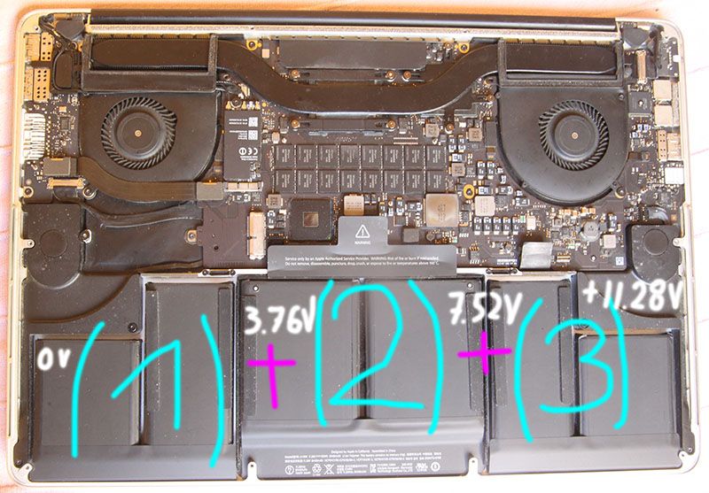 Interior of an open laptop with labeled battery configuration and capacities.