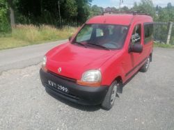 Red Renault Kangoo parked on the roadside.