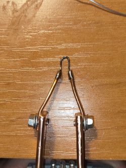 DIY soldering iron made from copper wire and a paperclip.