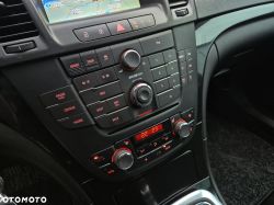 Central car console panel with navigation, radio, and climate control.